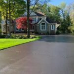 Driveway recently coated with asphalt